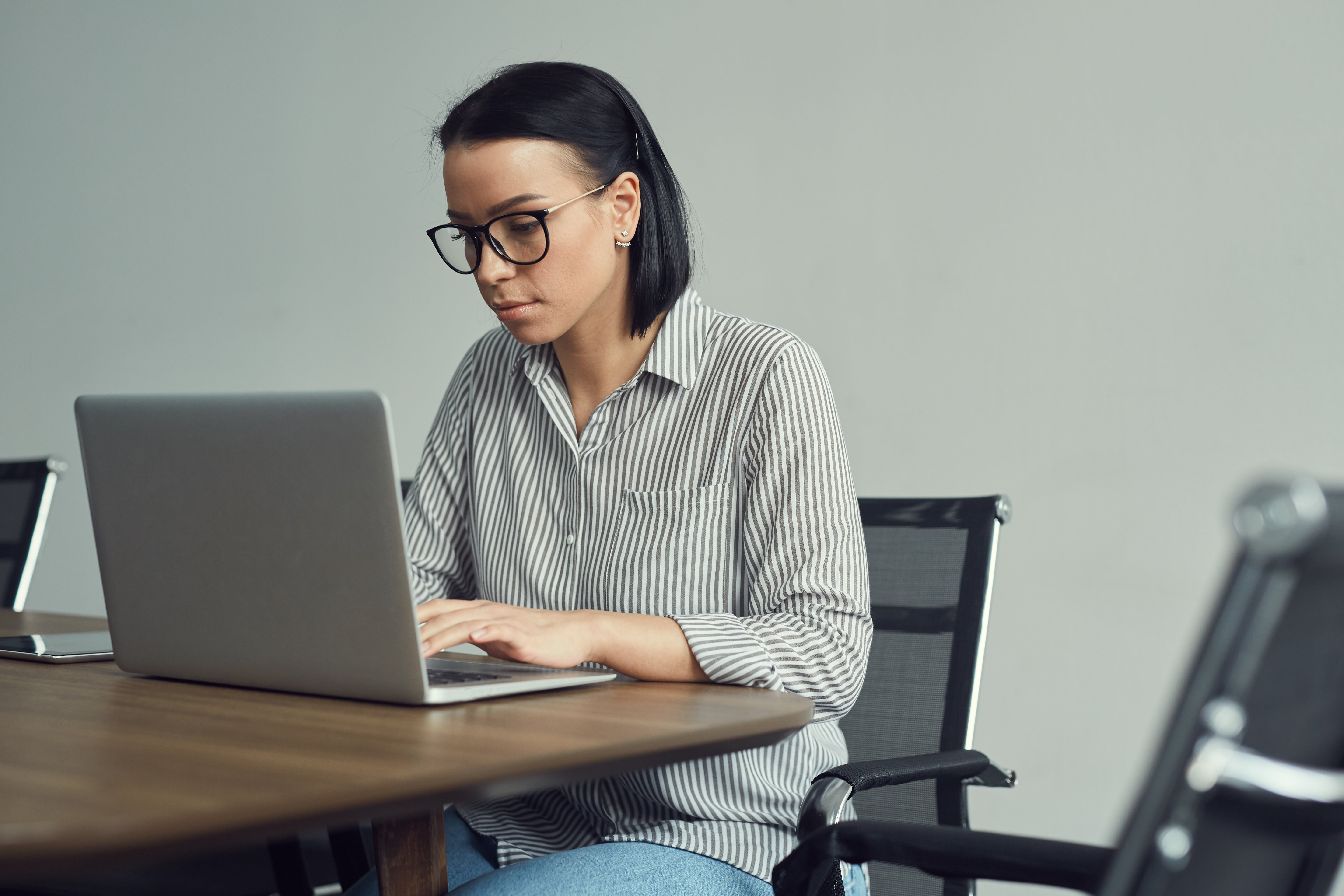 woman typing on laptop