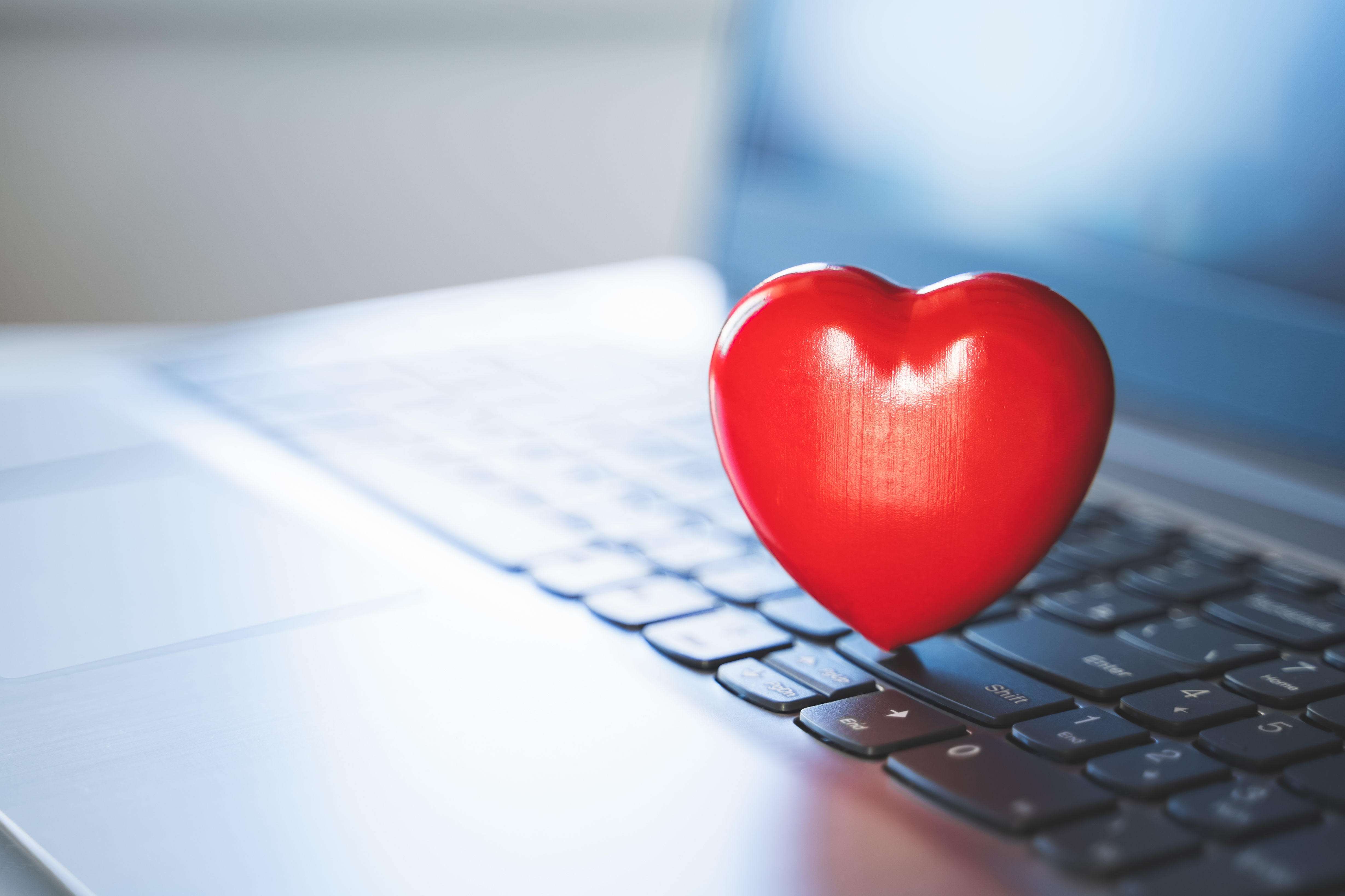 Big red heart on a laptop keyboard